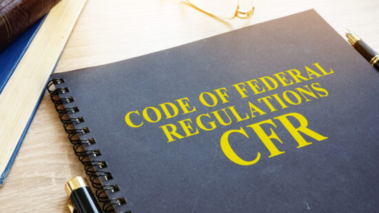 Code of Federal Regulations (CFR) and glasses.